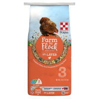 Purina Farm to Flock 18% Layer Food. Orange 50-lb poultry feed bag.